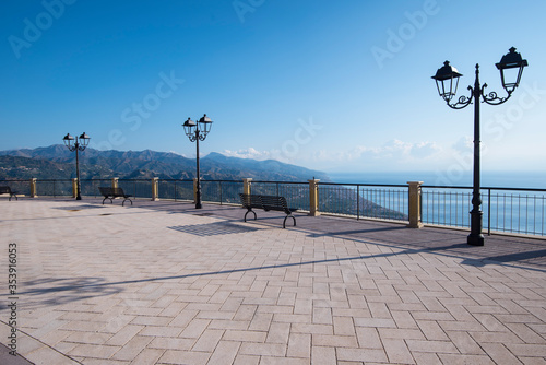 A newly paved area with lamp posts and benches for relaxing and taking in the beautiful view of the Sicilian coast and distant hills