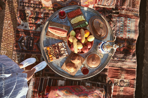 Taste it. Top view of traditional turkish hotel breakfast with fruits and vegetables in Cappadocia, Turkey