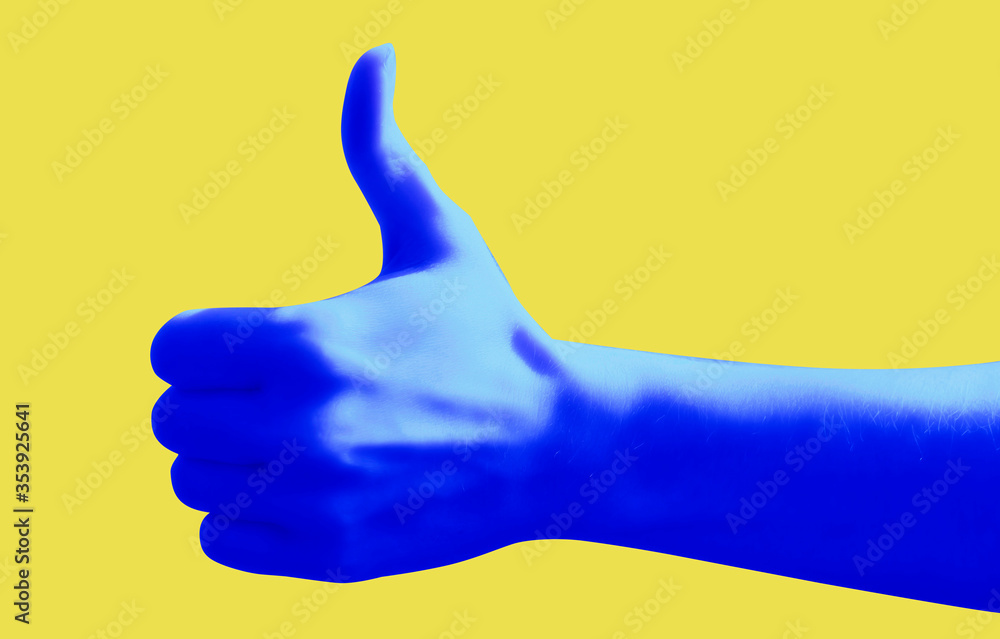 Blue hand gesture on yellow background poster. Thumb up. Like.