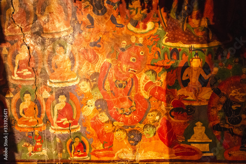 Ancient frescoes of Tibetan mythological iconography inside a Buddhist monastery