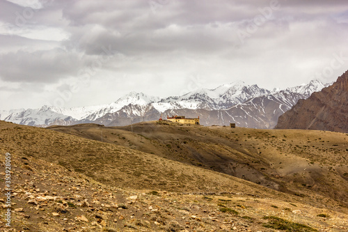 The scenic setting of the Langza monastery with a Himalayan mountain range in the background