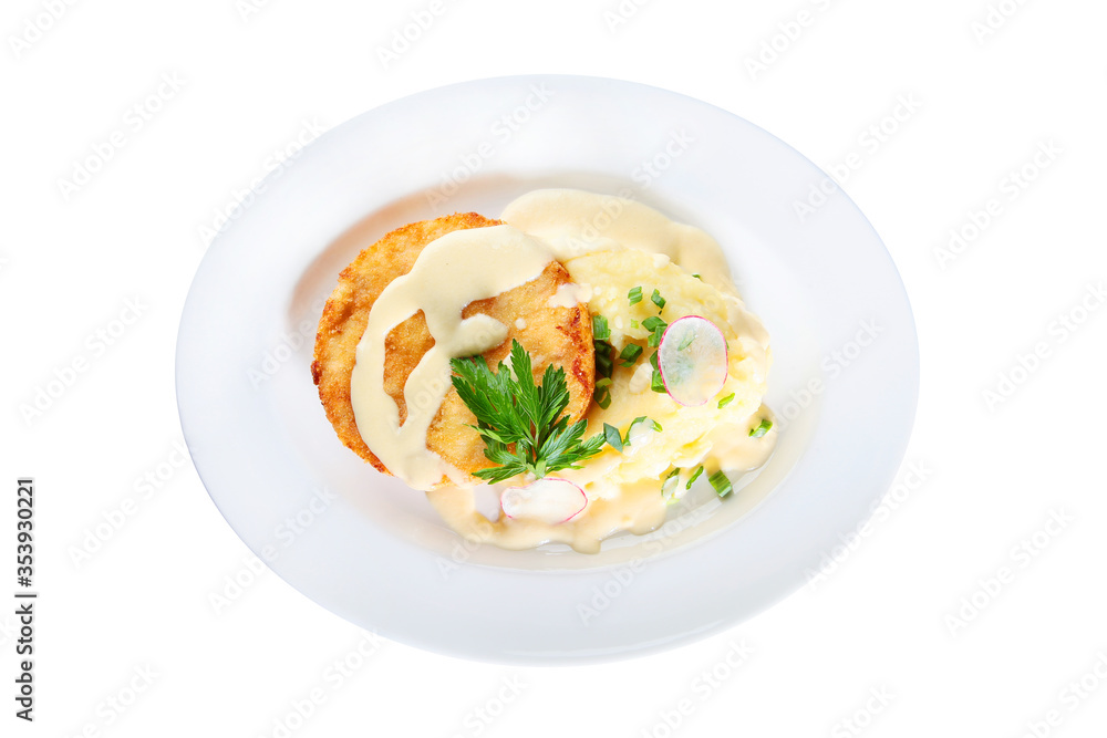 Breaded chicken cutlet with mashed potatoes on a white plate. An isolated object.Top view.
