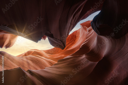 Antelope Canyon near page Arizona. Abstract colorful and texture background. Sunlight and beams into the canyon. Structure wall with different colors. Travel and art concept.