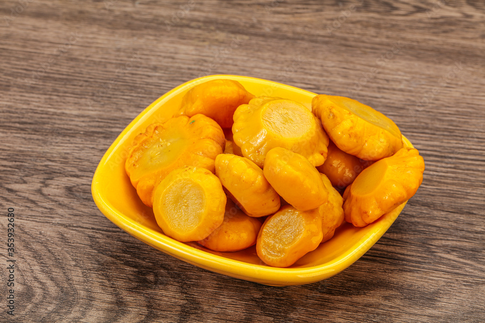 Marinated yellow patisson in the bowl Marinated yellow patisson in the bowl