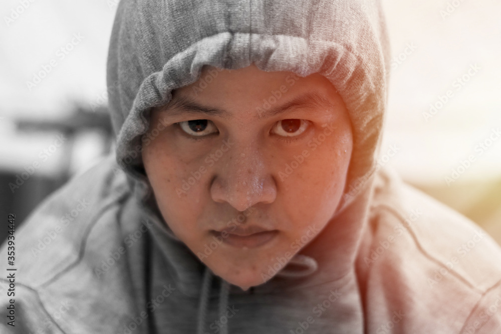 Close up portrait of Asian woman face when doing hard workout at home, intense look in her eyes with sweat on her face, tired female of doing cardio exercise Close up portrait of Asian woman face when doing hard workout at home, intense look in her eyes with sweat on her face, tired female of doing cardio exercise