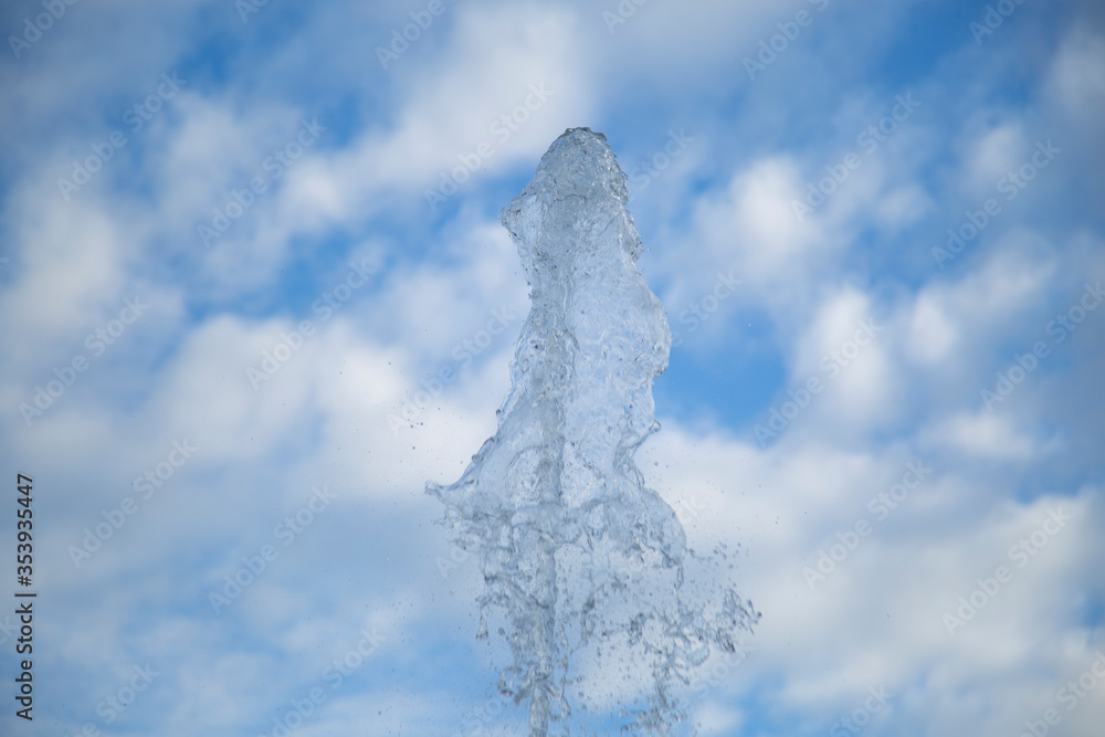 Clean and artesian water from the well. A stream of water against the sky. Clean and artesian water from the well. A stream of water against the sky.