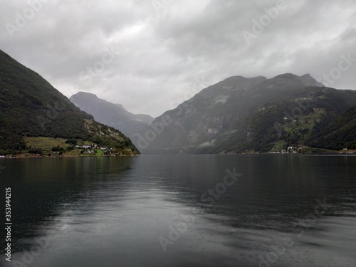 View on Geiranger fjord, rocks and the valley at cloudy weather.