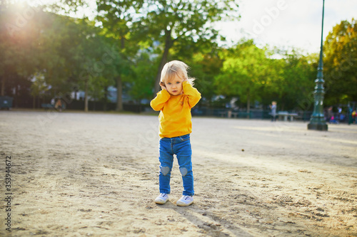 Adorable toddler girl walking in park © Ekaterina Pokrovsky