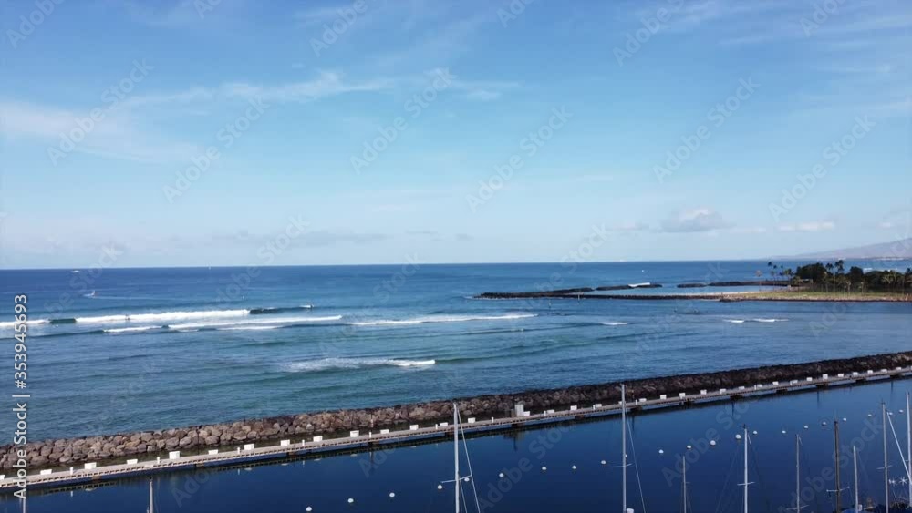 Cinematic aerial drone video of boat harbor by vacant Waikiki Beach, near the backdrop of iconic Ala Moana in Hawaii. Cinematic aerial drone video of boat harbor by vacant Waikiki Beach, near the backdrop of iconic Ala Moana in Hawaii.