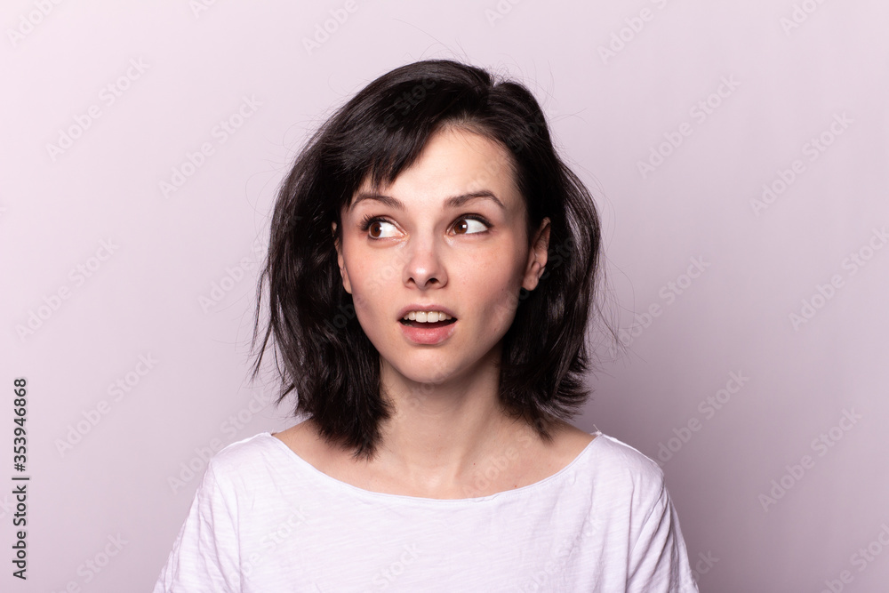 pretty woman in white t-shirt on gray background pretty woman in white t-shirt on gray background