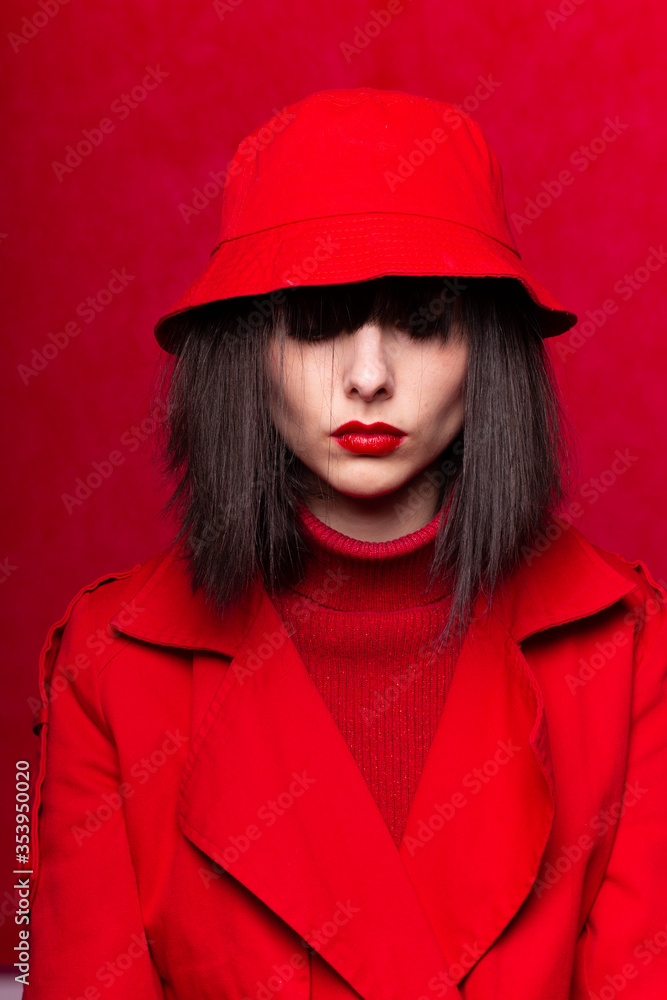 beautiful woman in a red trench coat beautiful woman in a red trench coat