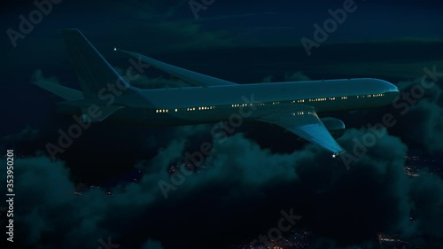 Commercial jet airplane flying above the city lights and night clouds in moonlight
