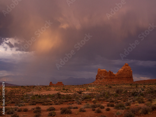 Arches National Park with dramatic clouds.
