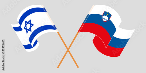 Crossed and waving flags of Slovenia and Israel
