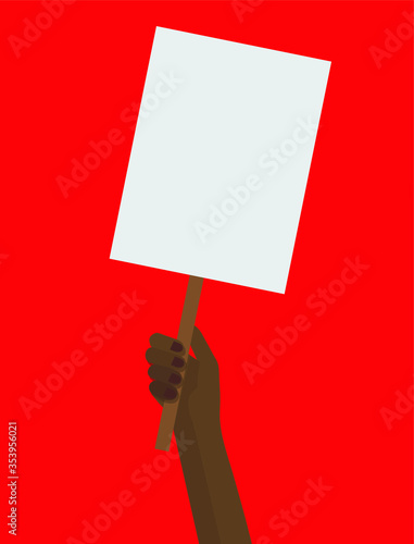 Black hand holding a protest placard