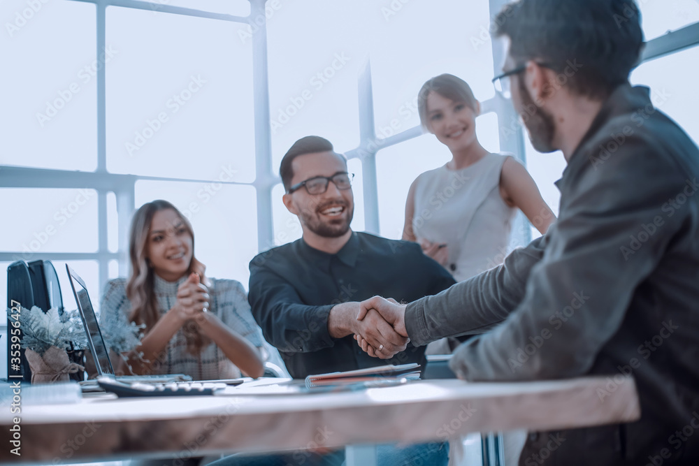 background image of the handshake of business partners in the office background image of the handshake of business partners in the office