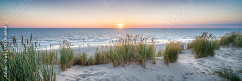 Dune beach panorama at sunset photo