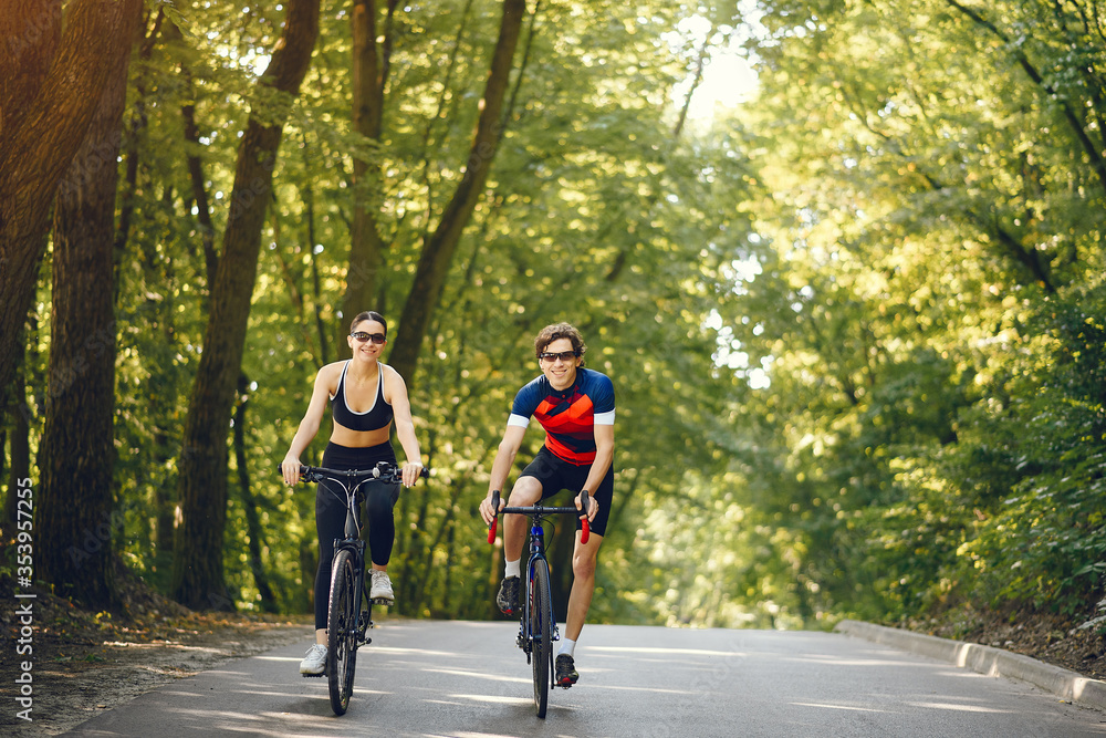 People with a bikes. Couple in a forest. Morning bike ride. People with a bikes. Couple in a forest. Morning bike ride.