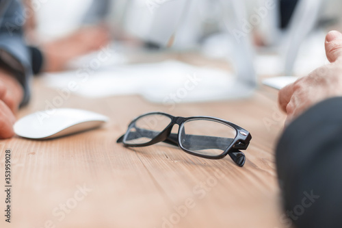 close up. glasses at the workplace of a businessman