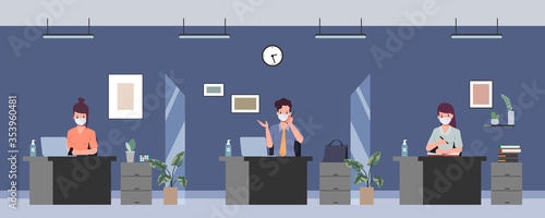 Business office people maintain social distancing in working room. 