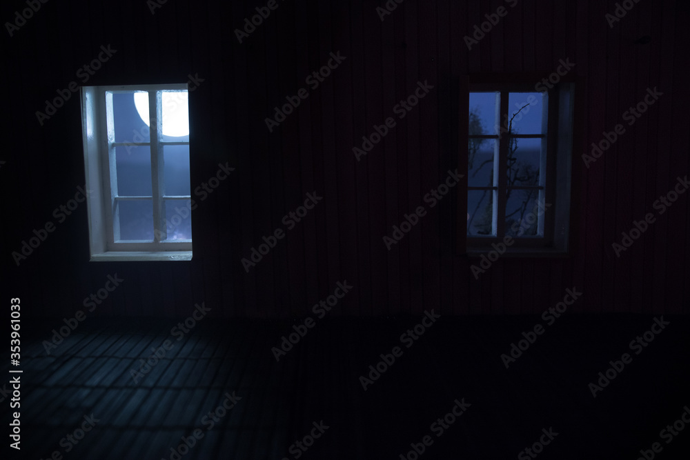 Night scene of moon seen through the window from dark room. Moonlight inside dark room Night scene of moon seen through the window from dark room. Moonlight inside dark room