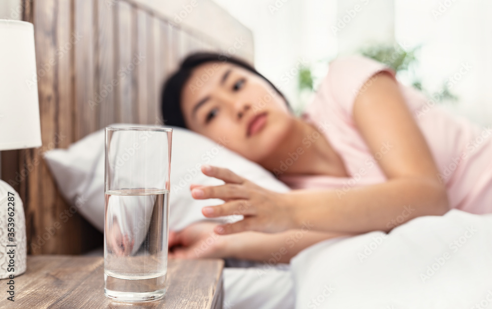 Chinese Girl Drinking Water In Morning Lying In Bed Indoor Chinese Girl Drinking Water In Morning Lying In Bed Indoor