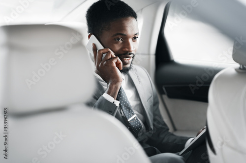 Businessman Talking On Mobile Phone In Car Commuting To Work © Prostock-studio