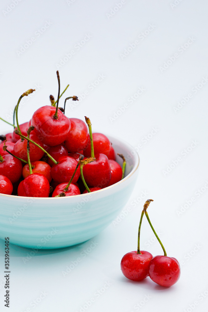 Cherries in a light blue porcelain dish Cherries in a light blue porcelain dish