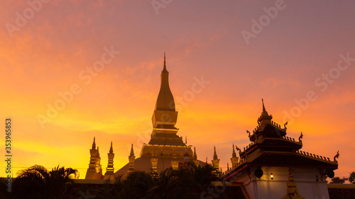 Pha That Luang Vientiane Golden Pagoda in Vientiane  Laos. sunset sky background beautiful.