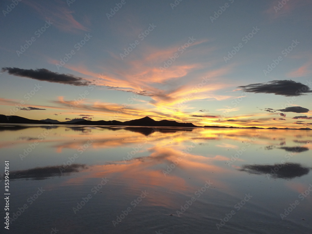 a delightful sunset over a dry salt lake in Uyuni Bolivia