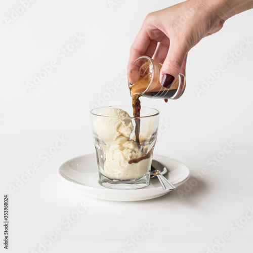 hand pouring espresso over gelato