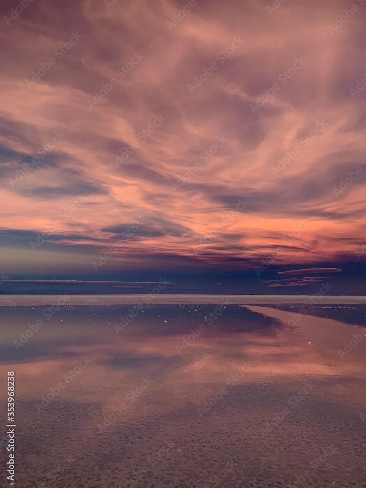 fantastic sunset over a dry salt lake in Uyuni Bolivia