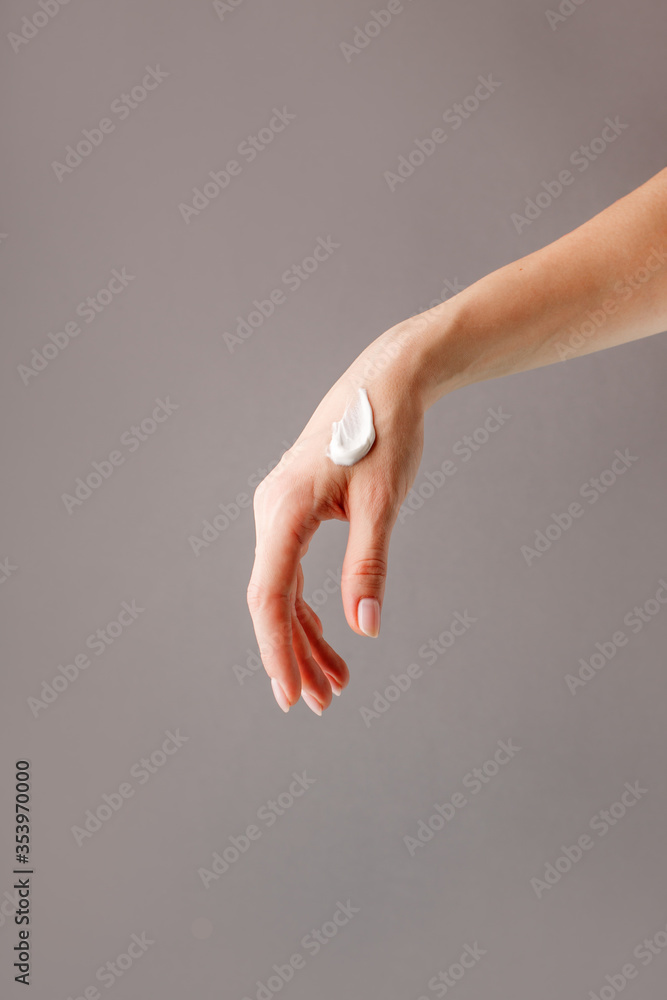 Hand skin care. Closeup of beautiful woman hands with light manicure on nails . Cream for hands and treatment, beauty industry banner, wellness spa salon minimal concept Hand skin care. Closeup of beautiful woman hands with light manicure on nails . Cream for hands and treatment, beauty industry banner, wellness spa salon minimal concept