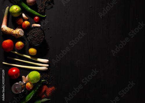 spices with ingredients on dark background. asian food, healthy or cooking concept.