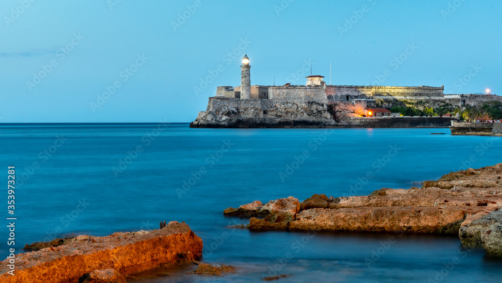 Havana, Cuba. Lighthouse and Morro Castle mirroring in the Caribbean Sea.