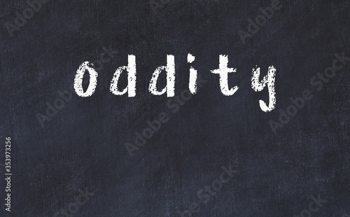 College chalk desk with the word oddity written on in