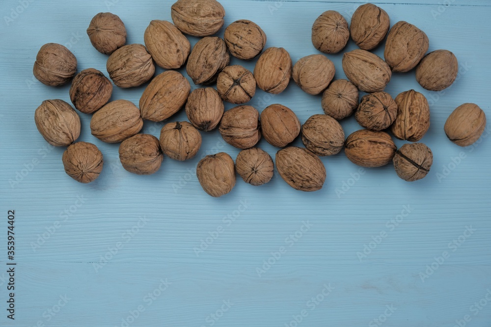 Walnut set on a blue wooden background.Organic Pure Bio Product. Useful Snack. Healthy fats Walnut set on a blue wooden background.Organic Pure Bio Product. Useful Snack. Healthy fats