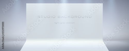Empty studio in high key with spotlights beams. The ray of the searchlight in the air and floor. Studio room. Modern background for showing of brand or product. Vector 3d illustration