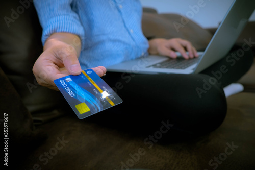 Using a credit card to buy things online for your holiday at home for pleasure and as a business online.