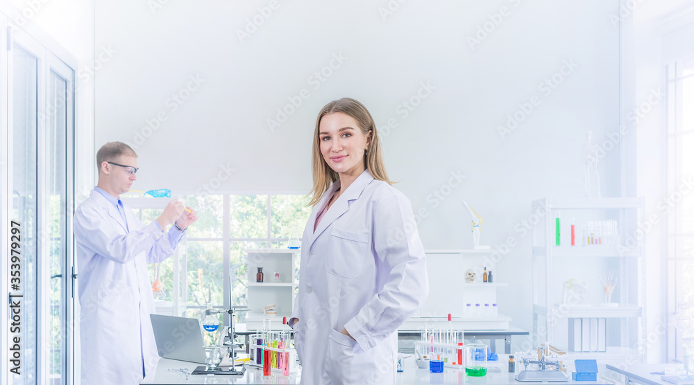 Scientists researching for some confidential in chemical laboratory Scientists researching for some confidential in chemical laboratory