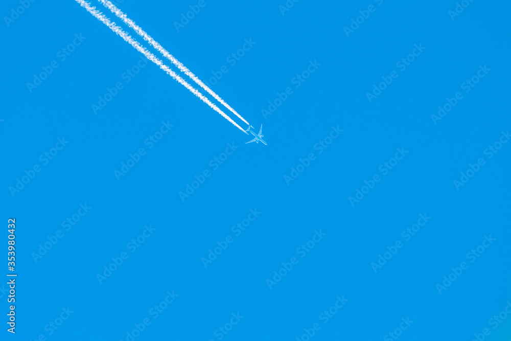 Airplane flies high in the sky with contails Airplane flies high in the sky with contails