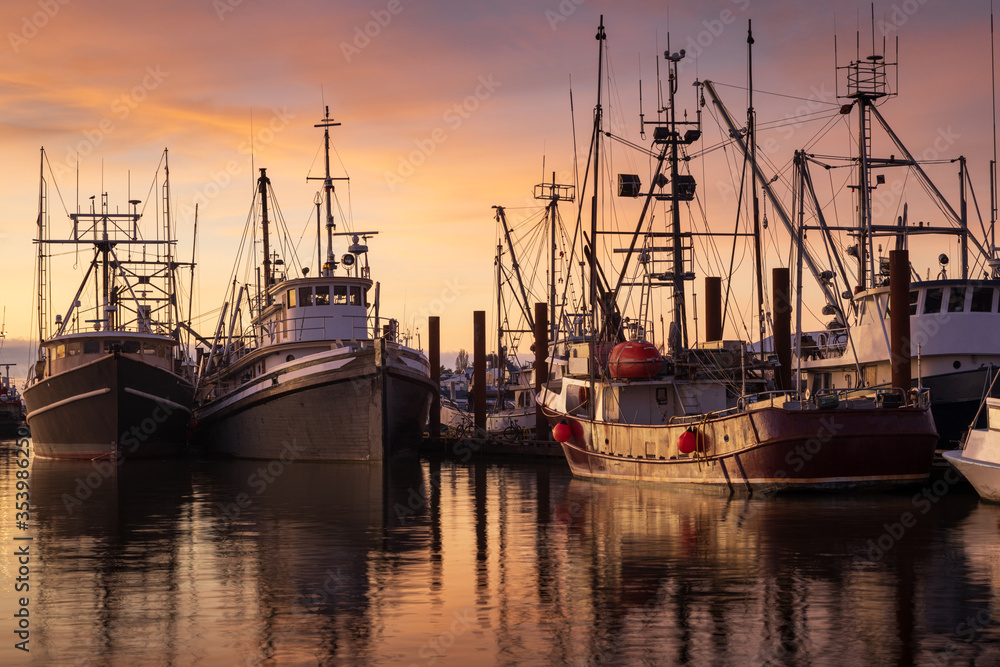 Fishing boats in Steveston Harbour at dusk, Richmond, British Columbia.