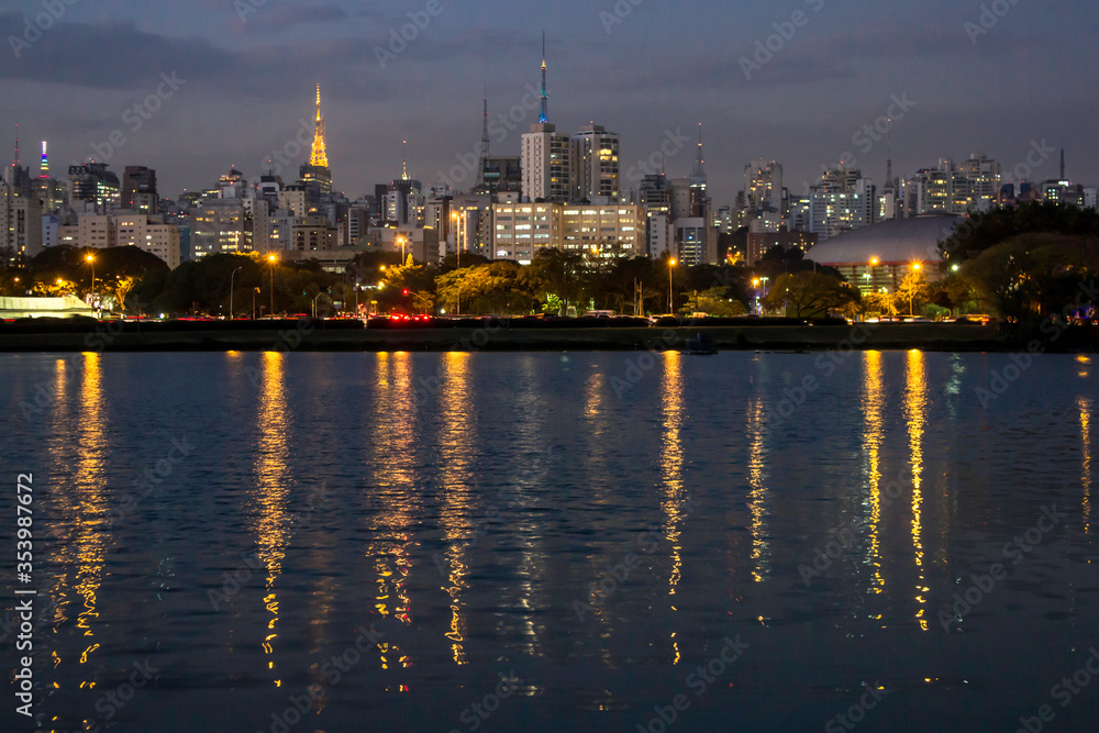 Sao Paulo, Brazil, August 13, 2013. Night view lake in Ibirapuera Park and Sky line of city in Sao Paulo Sao Paulo, Brazil, August 13, 2013. Night view lake in Ibirapuera Park and Sky line of city in Sao Paulo