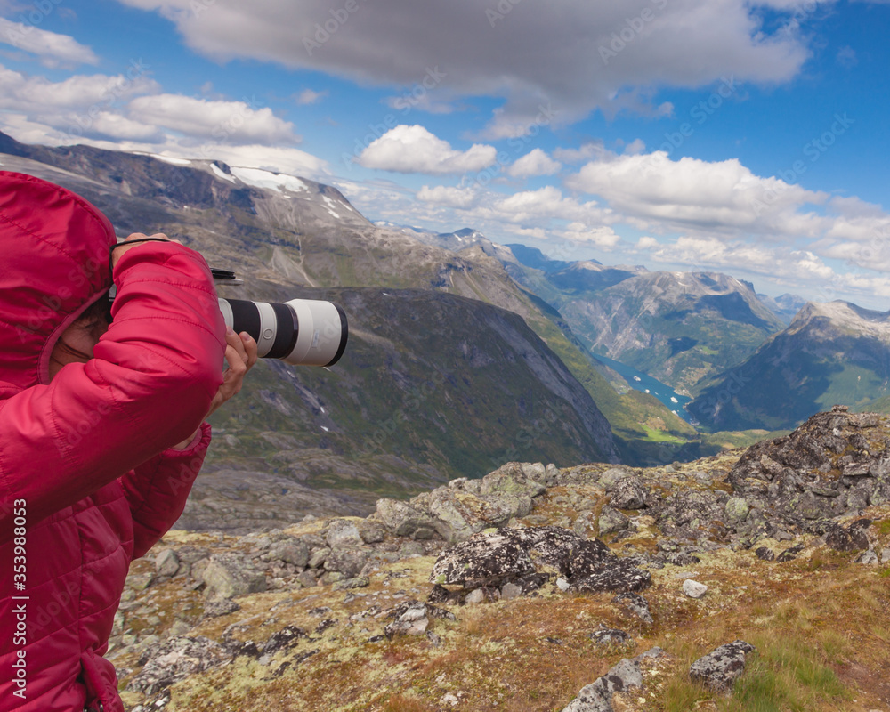 Tourist taking photo from Dalsnibba viewpoint Norway