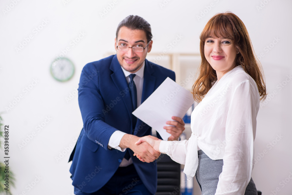 Business meeting between businessman and businesswoman Business meeting between businessman and businesswoman