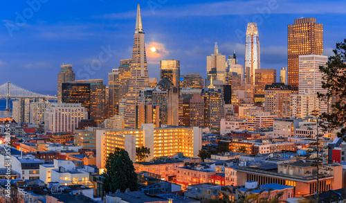 San Francisco downtown skyline at dusk with the full moon between the skyscrapers © SvetlanaSF