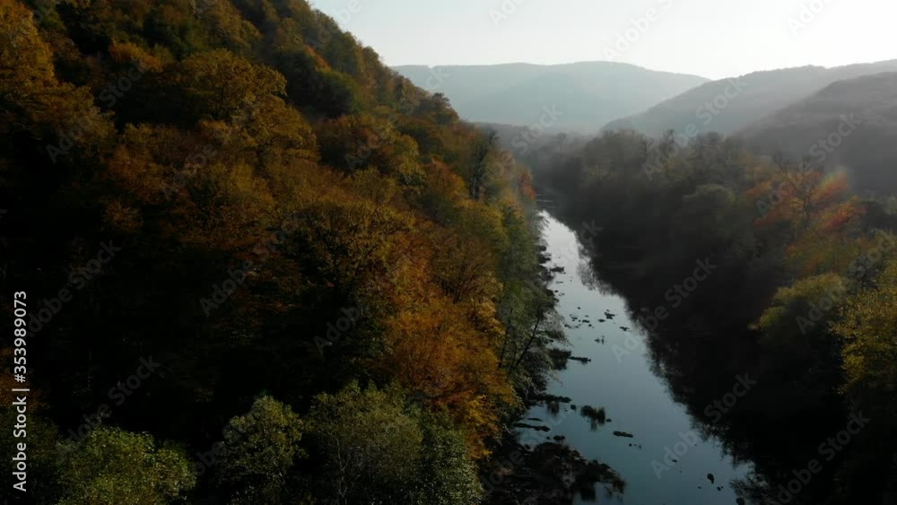 Drone shooting over a beautiful clean calm mountain river. Hilly terrain. Natural beauty. Aerial shots using a drone. The beauty of Russian nature. Drone shooting over a beautiful clean calm mountain river. Hilly terrain. Natural beauty. Aerial shots using a drone. The beauty of Russian nature.