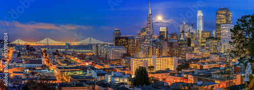 San Francisco downtown skyline sunset panorama with Bay Bridge and full moon between skyscrapers from Ina Coolbirth park © SvetlanaSF