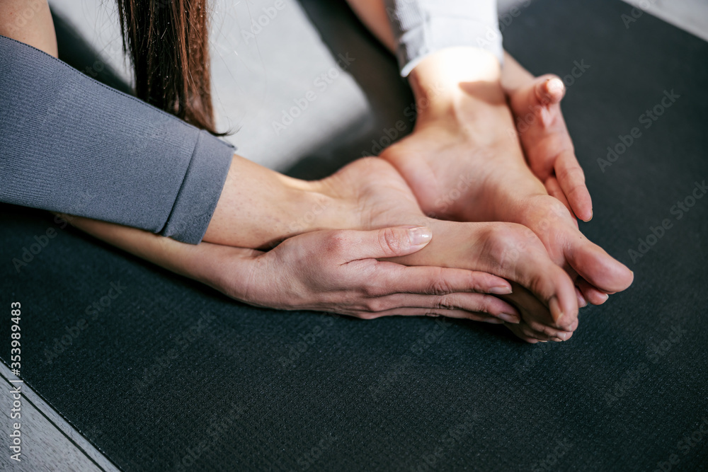 Closeup of woman’s feet in lotus position.