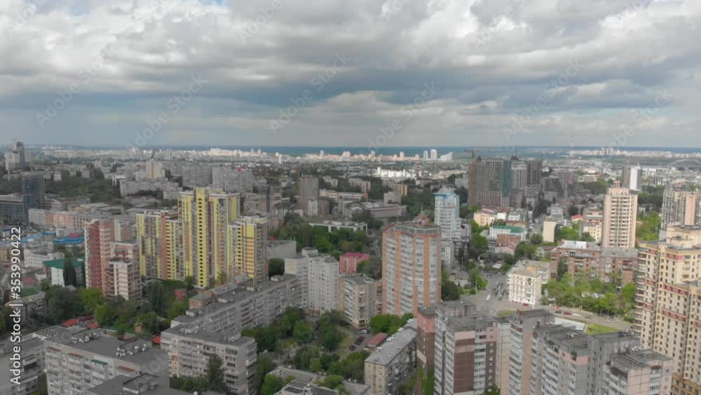 Big city and clouds aerial cityscape multistory houses apartment buildings push in forward movement tilt down Kyiv Ukraine Big city and clouds aerial cityscape multistory houses apartment buildings push in forward movement tilt down Kyiv Ukraine